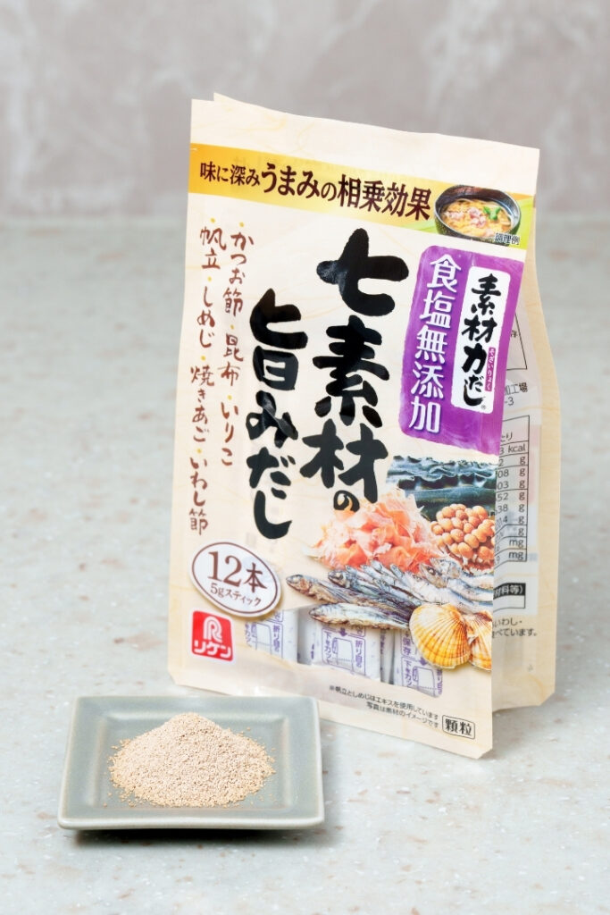 Dashi powder and package displayed on a small plate.