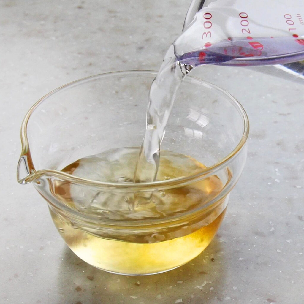 Water being poured into shiro dashi to dilute it.