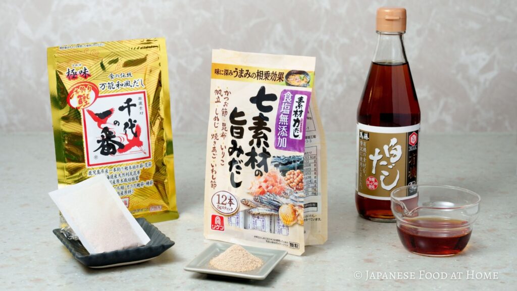 Dashi packets, dashi powder, and shiro dashi arranged on a countertop for Japanese home cooking.