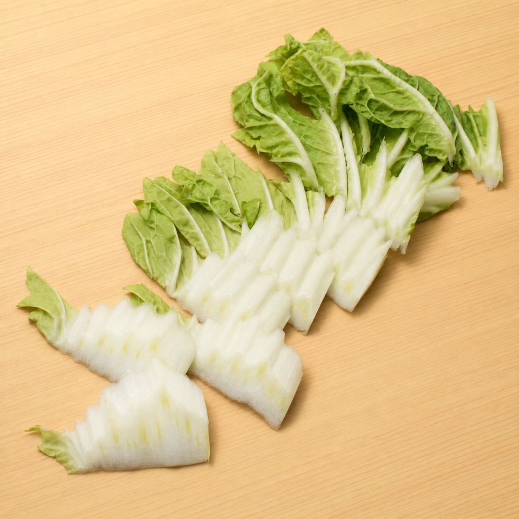 Napa cabbage cut into thin diagonal slices using the sogigiri technique