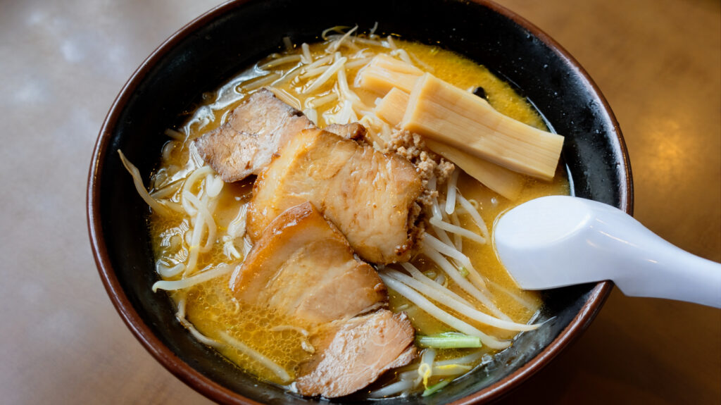 Toku Miso Ramen at Asahi Shokudo in Kamikawa, Hokkaido, topped with chashu pork, bean sprouts, menma, and minced pork.