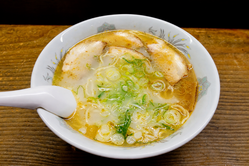 Shio ramen at Kiyoshi Shokudo in Kamikawa, Hokkaido, topped with four slices of chashu pork and green onions.