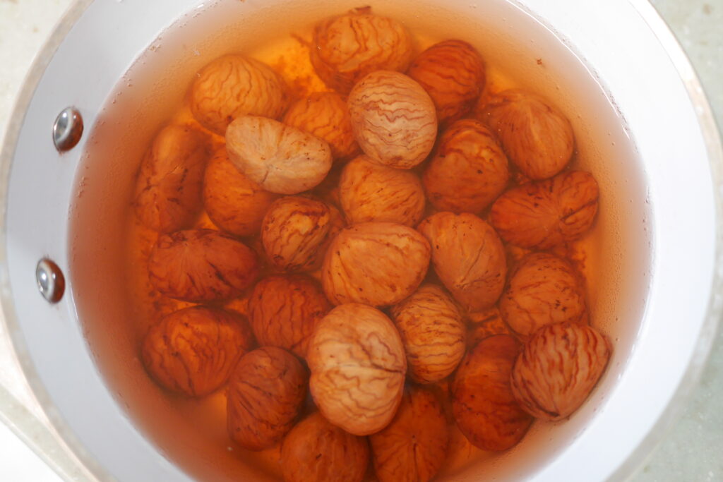 Cleaned chestnuts soaking in fresh water to keep the inner skin from drying out